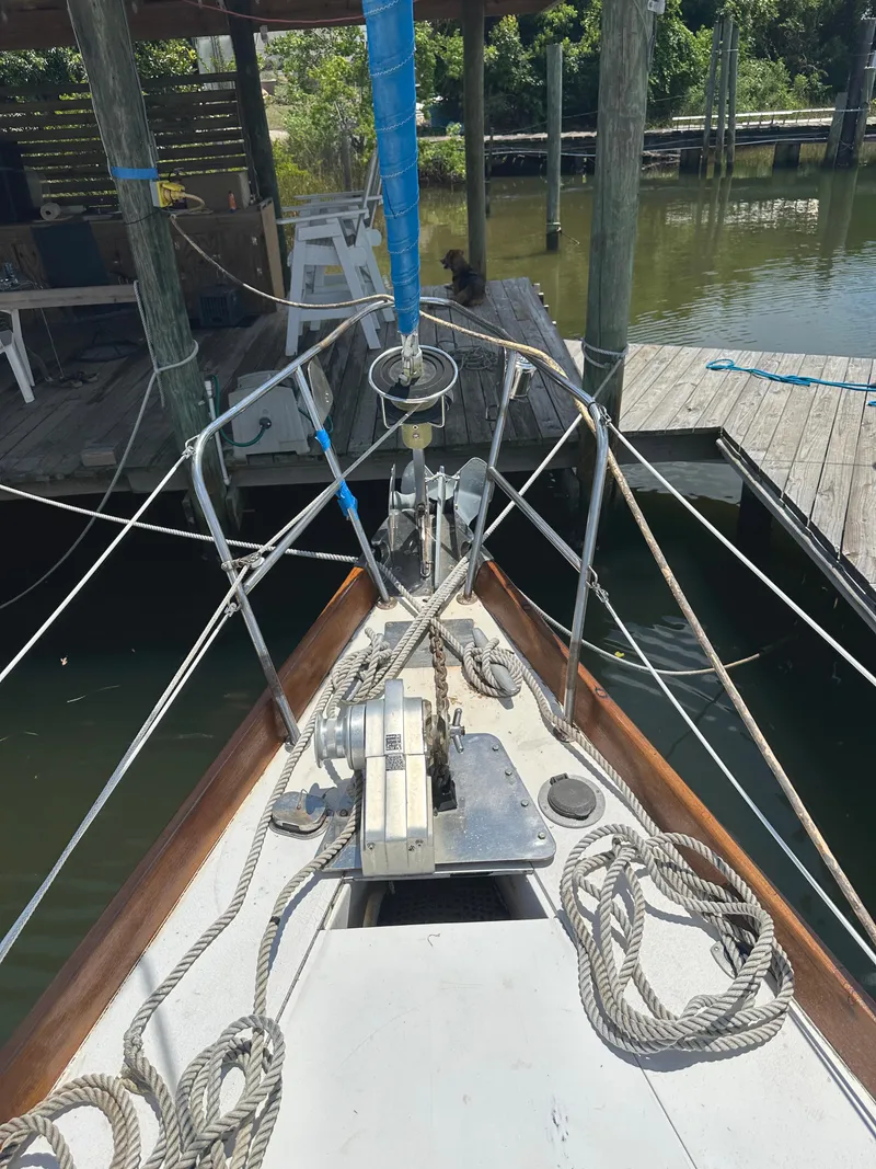 Slide: The Image of Bow of 1984 Bristol 38.8 sailboat docked, featuring ropes and winch. - 14