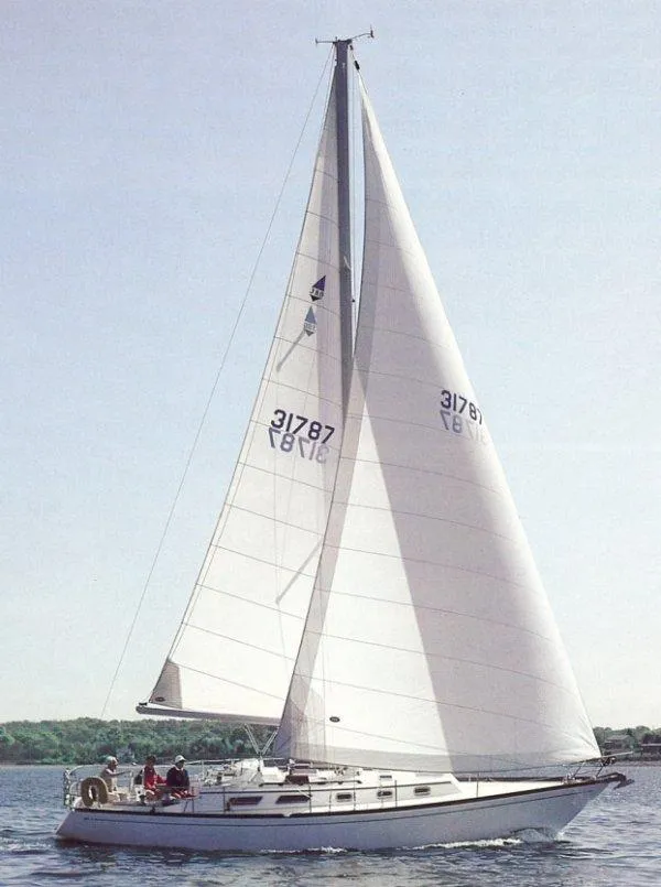Slide: The Image of 1984 Bristol 38.8 sailboat with white sails on open water. - 17
