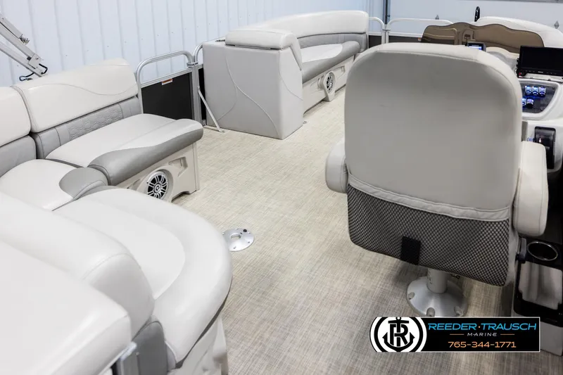 Slide: The Image of Interior of a 2019 Avalon GS CR pontoon boat with plush seating and modern controls. - 12