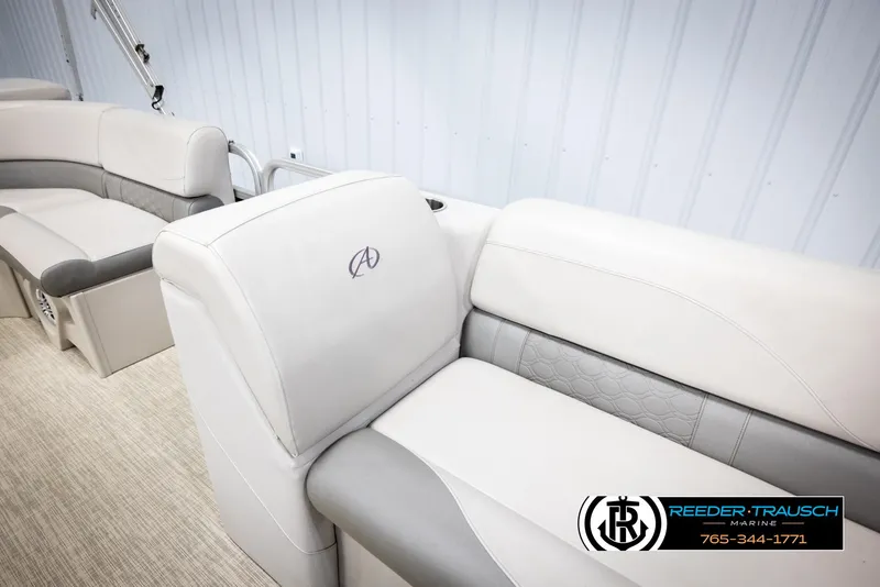 Slide: The Image of 2019 Avalon GS CR boat interior with gray and white seating, Reeder-Trausch Marine logo. - 21