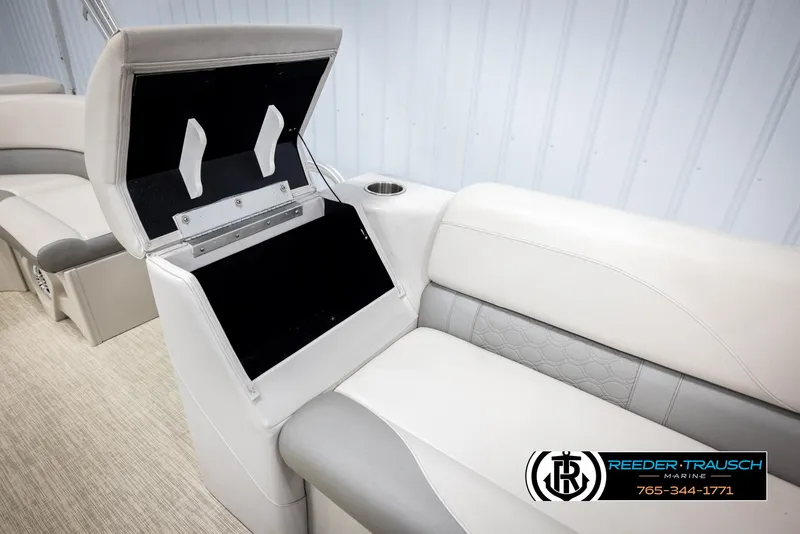 Slide: The Image of 2019 Avalon GS CR boat seat with storage compartment open, featuring white and gray upholstery. - 22