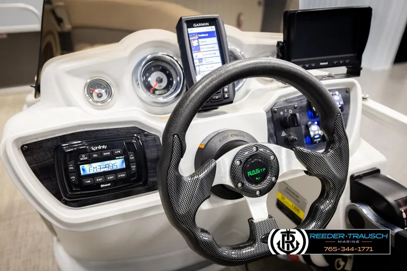 Slide: The Image of Steering console of 2019 Avalon GS CR boat with modern controls and navigation system. - 29
