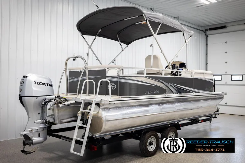 Slide: The Image of 2019 Avalon GS CR pontoon boat with Honda outboard motor in a showroom. - 6