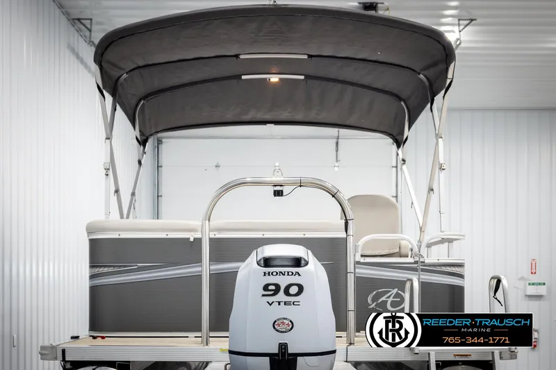 Slide: The Image of 2019 Avalon GS CR pontoon boat with Honda 90 VTEC engine in a showroom. - 7