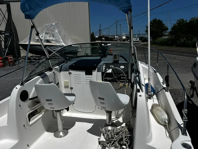 Slide: The Image of Interior of a 1999 Bayliner Trophy boat with steering wheel and seating. - 11