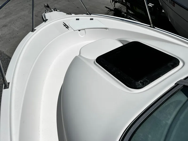 Slide: The Image of Bow of 1999 Bayliner Trophy 2002 boat with hatch and railing. - 13