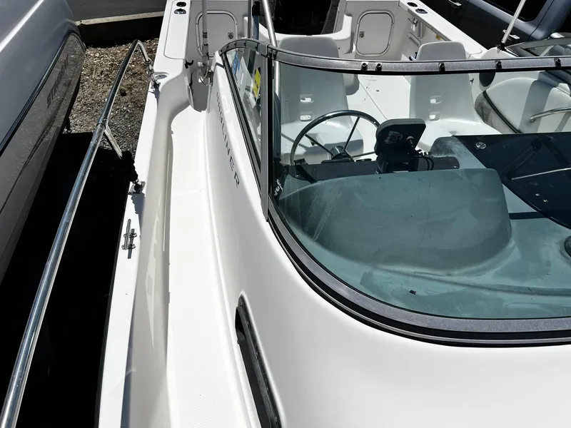 Slide: The Image of Bayliner 2002 Trophy boat, 1999 model, featuring a sleek white deck and windshield. - 15