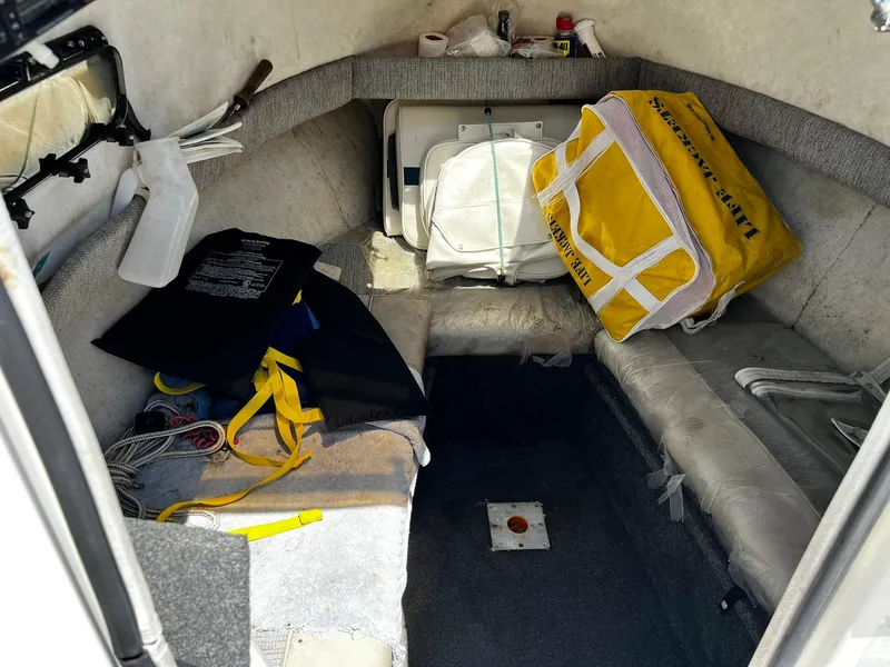 Slide: The Image of Interior of a 1999 Bayliner Trophy boat with safety gear and equipment. - 25