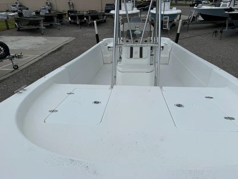 Slide: The Image of 2011 Carolina Skiff 218 DLV boat interior, featuring spacious deck and center console. - 10