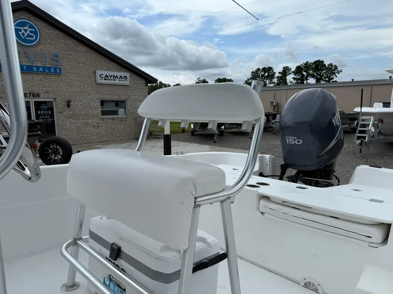 Slide: The Image of 2011 Carolina Skiff 218 DLV boat with Yamaha 150 engine at dealership. - 13