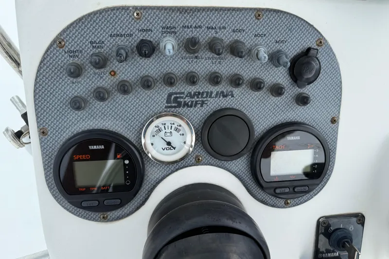 Slide: The Image of Control panel of a 2011 Carolina Skiff 218 DLV boat with Yamaha gauges. - 18