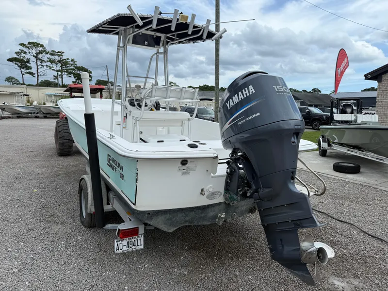 Slide: The Image of 2011 Carolina Skiff 218 DLV with Yamaha 150 outboard motor on trailer. - 4