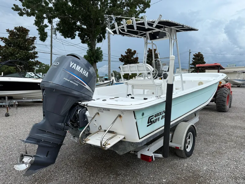 Slide: The Image of 2011 Carolina Skiff 218 DLV boat with Yamaha outboard motor on trailer. - 6