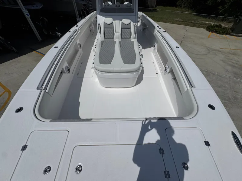 Slide: The Image of 2026 Invincible 38 Catamaran with spacious deck and seating area. - 18