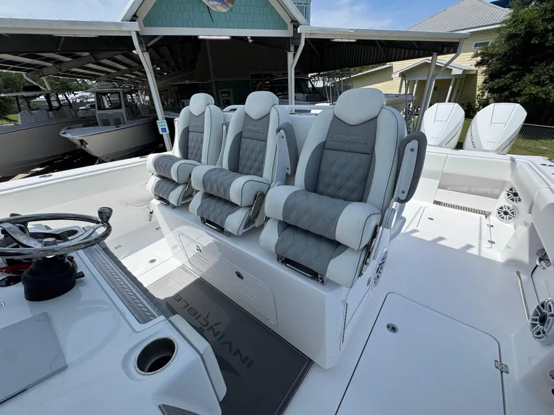 Slide: The Image of 2026 Invincible 38 Catamaran interior with luxury seating and modern helm design. - 26