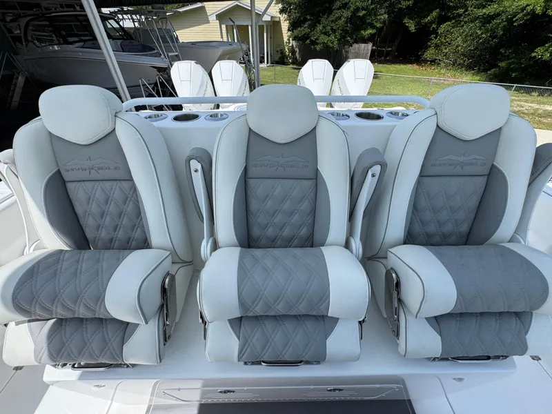 Slide: The Image of Luxurious seating on 2026 Invincible 38 Catamaran, featuring plush, diamond-stitched upholstery. - 27