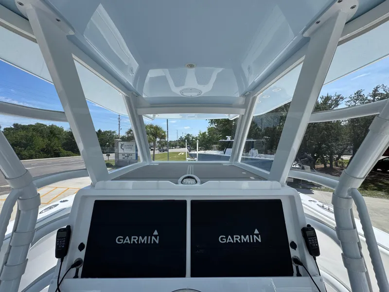 Slide: The Image of 2026 Invincible 38 Catamaran cockpit with Garmin displays and modern design. - 30