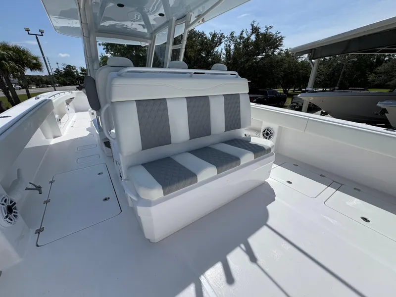 Slide: The Image of 2026 Invincible 38 Catamaran interior with cushioned seating and spacious deck. - 32