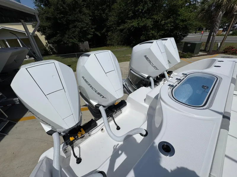 Slide: The Image of Triple Mercury outboard engines on a 2026 Invincible 38 Catamaran. - 39
