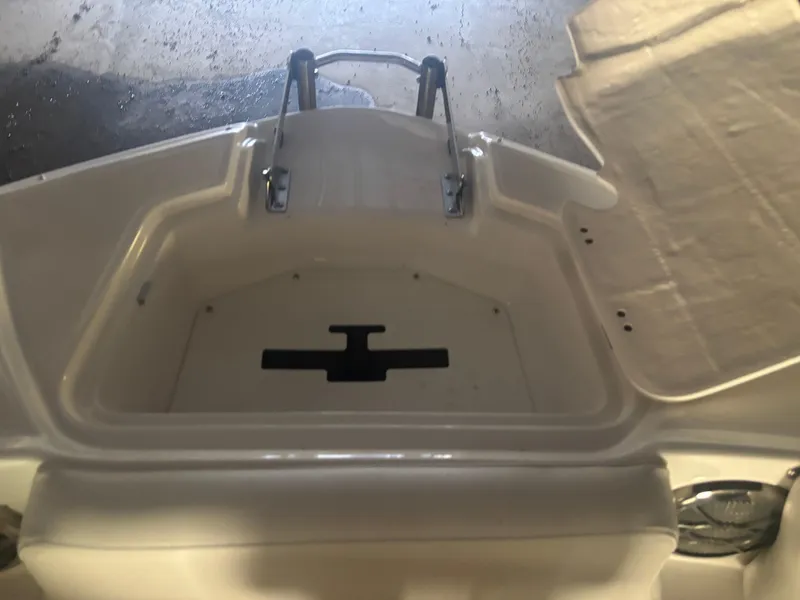 Slide: The Image of 2013 Hurricane SunDeck 2200 DC IO boat interior with swim platform and ladder. - 10