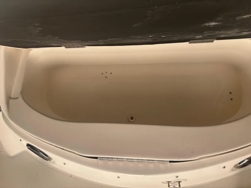 Slide: The Image of Open storage compartment on a 2013 Hurricane SunDeck 2200 DC IO boat. - 12