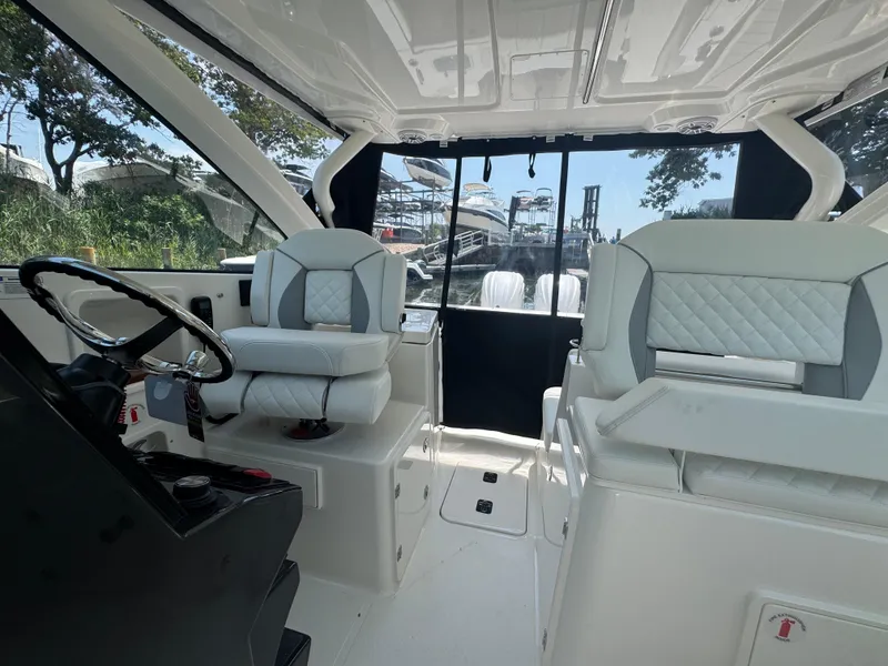 Slide: The Image of Interior of 2026 Pursuit DC 306 boat with luxurious seating and modern design. - 28