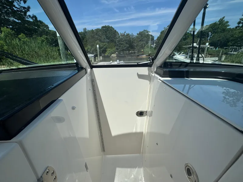 Slide: The Image of Interior view of 2026 Pursuit DC 306 boat, showcasing sleek design and spacious cockpit. - 32