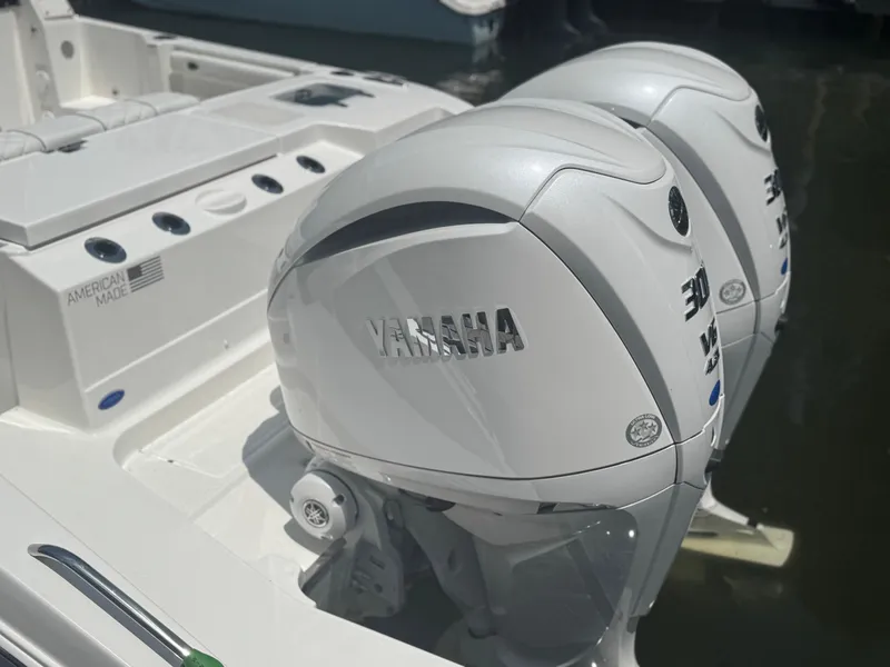 Slide: The Image of Twin Yamaha outboard engines on a 2026 Pursuit DC 306 boat, American-made. - 8