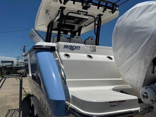 Slide: The Image of 2025 Robalo R300 Center Console boat, rear view, showcasing sleek design and modern features. - 5
