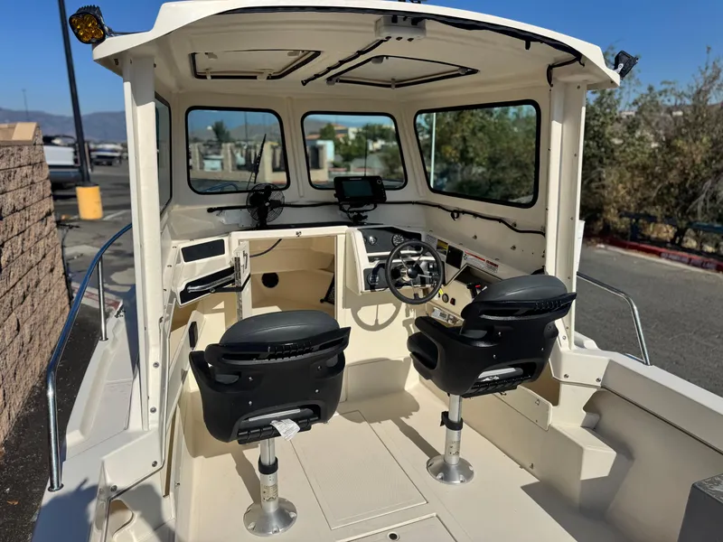 Slide: The Image of 2020 Arima Sea Chaser 19 Yellowtail Edition boat interior with dual seats and steering console. - 9