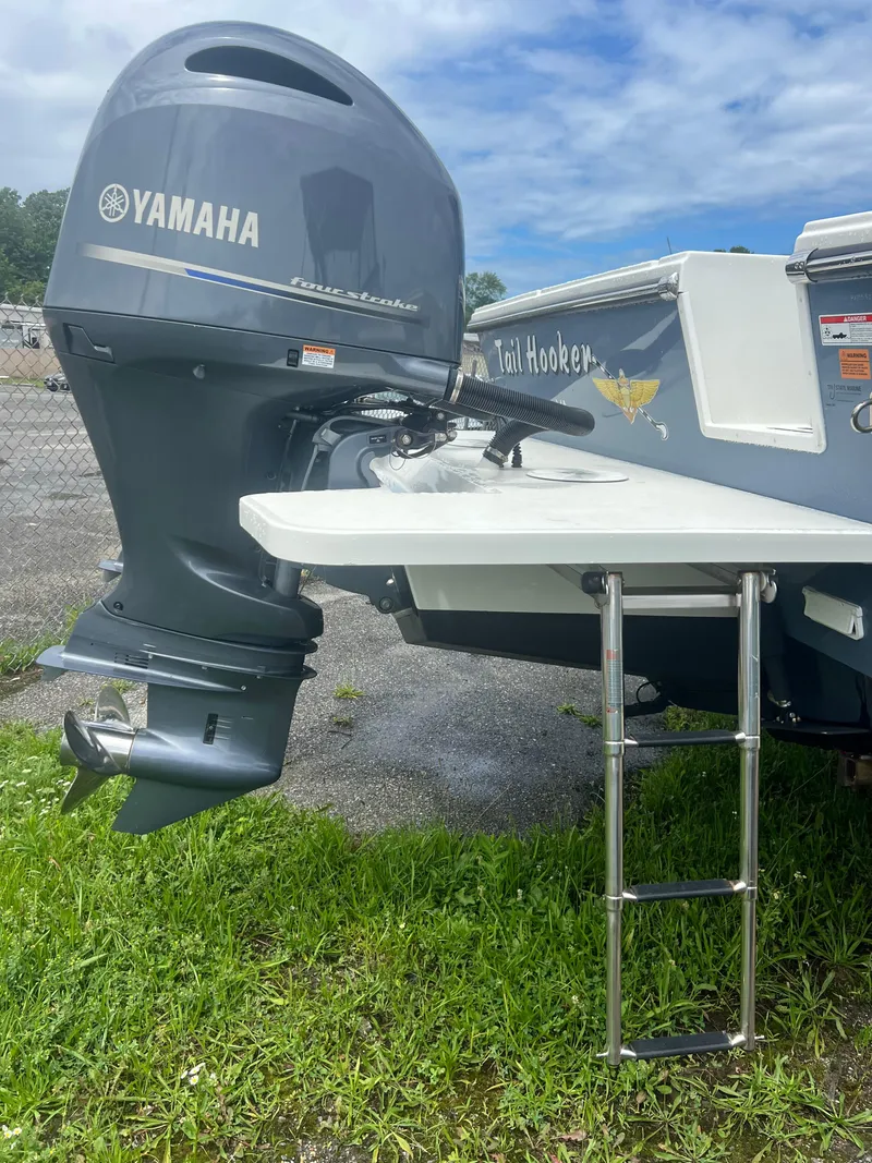Slide: The Image of 2021 Parker 2510 XL Walkaround with Yamaha outboard motor and swim ladder. - 6