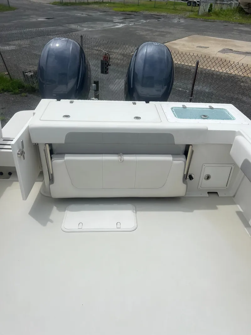 Slide: The Image of 2021 Parker 2510 XL Walkaround boat with dual engines and seating area. - 8