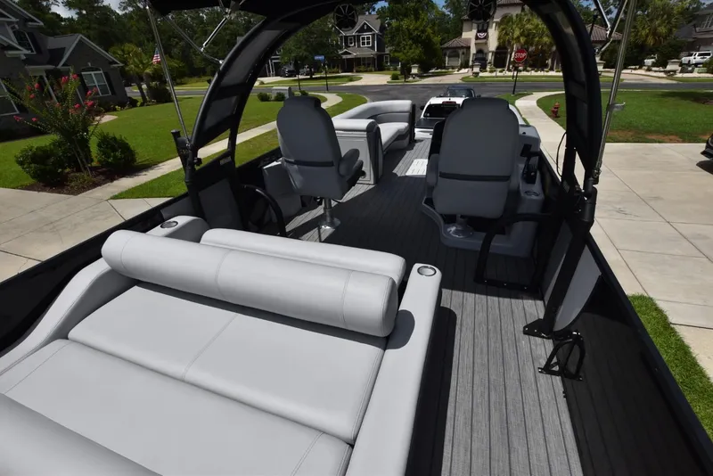 Slide: The Image of 2023 Bentley Pontoons 250 Elite Swingback Dual Captain interior with luxurious seating and modern design. - 12