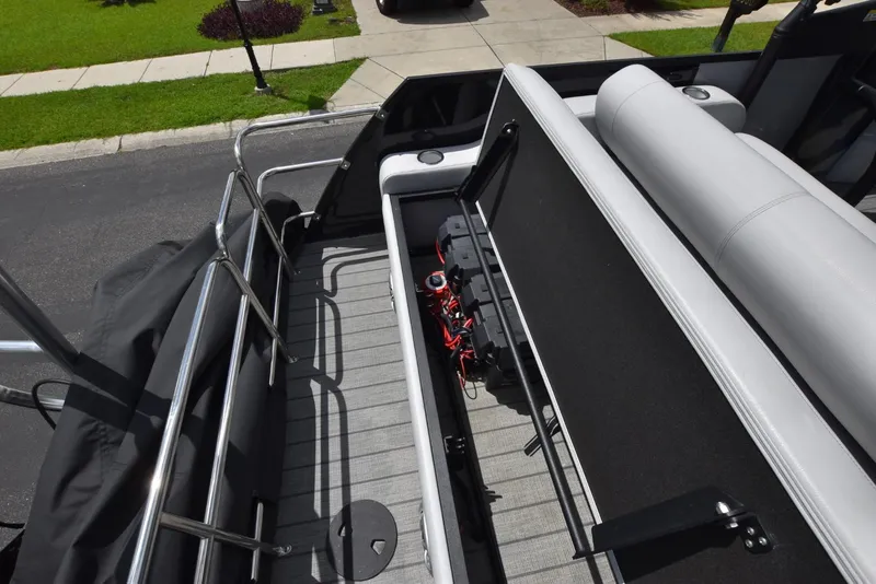 Slide: The Image of 2023 Bentley Pontoons 250 Elite Swingback Dual Captain, open storage compartment view. - 15