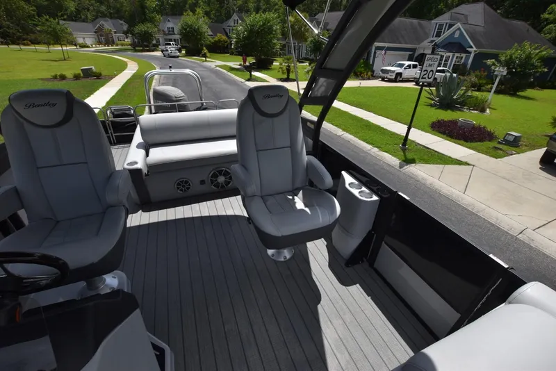 Slide: The Image of 2023 Bentley Pontoons 250 Elite Swingback Dual Captain interior with luxurious seating and modern design. - 5