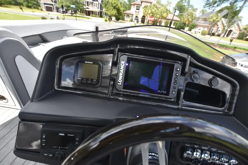 Slide: The Image of 2023 Bentley Pontoons 250 Elite Swingback Dual Captain dashboard with navigation and control systems. - 9