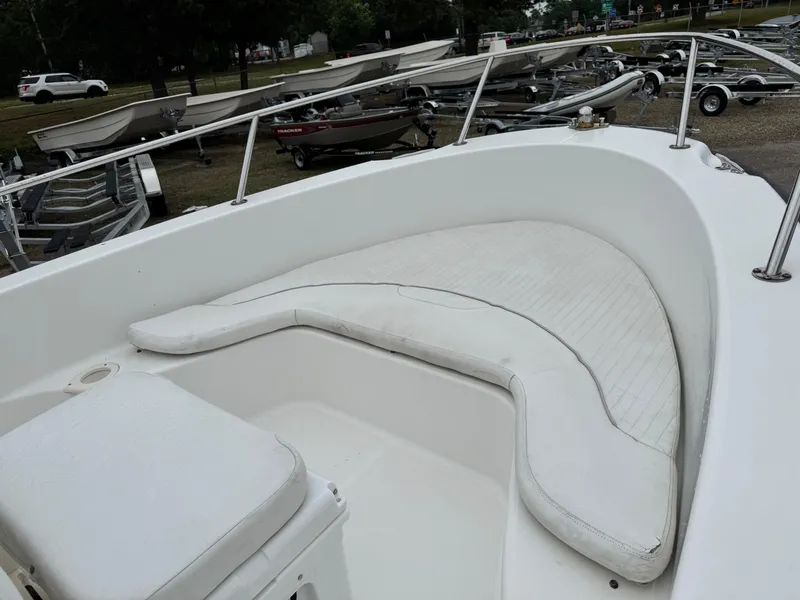 Slide: The Image of 2006 Boston Whaler 190 Outrage boat interior with white seating and railings. - 15