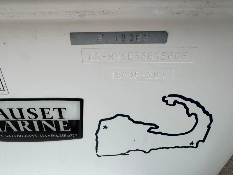 Slide: The Image of 2006 Boston Whaler 190 Outrage boat identification details and Nauset Marine sticker. - 16
