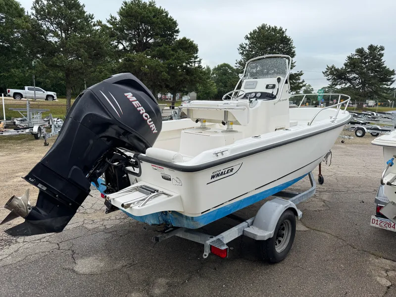 Slide: The Image of 2006 Boston Whaler 190 Outrage boat on trailer with Mercury outboard motor. - 7