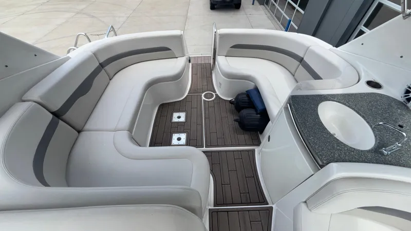Slide: The Image of 2007 Chaparral Signature 330 boat interior with U-shaped seating and sink. - 15