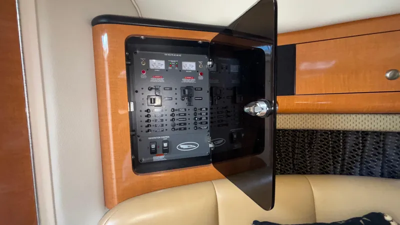 Slide: The Image of Electrical panel inside 2007 Chaparral Signature 330 boat, featuring control switches and indicators. - 16
