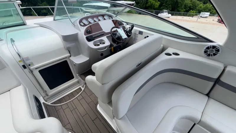 Slide: The Image of 2007 Chaparral Signature 330 boat interior with modern dashboard and comfortable seating. - 27