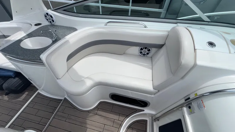Slide: The Image of 2007 Chaparral Signature 330 interior with white seating and built-in sink. - 31