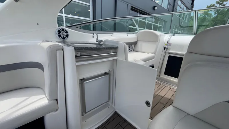 Slide: The Image of 2007 Chaparral Signature 330 boat interior with seating, sink, and storage. - 35