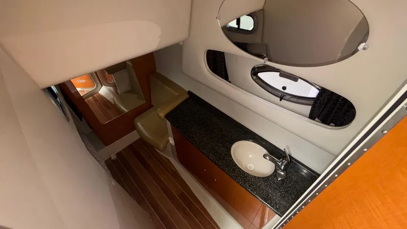 Slide: The Image of 2007 Chaparral Signature 330 bathroom with sink, mirror, and wooden flooring. - 36