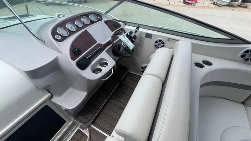 Slide: The Image of 2007 Chaparral Signature 330 boat interior with dashboard, steering wheel, and seating area. - 39