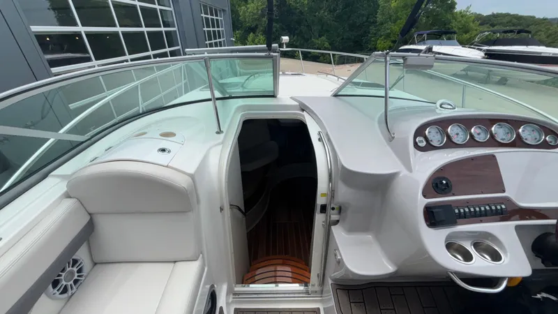 Slide: The Image of 2007 Chaparral Signature 330 boat cockpit with helm, gauges, and cabin entrance. - 41