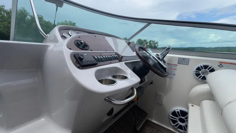 Slide: The Image of 2007 Chaparral Signature 330 helm with steering wheel and control panel. - 43