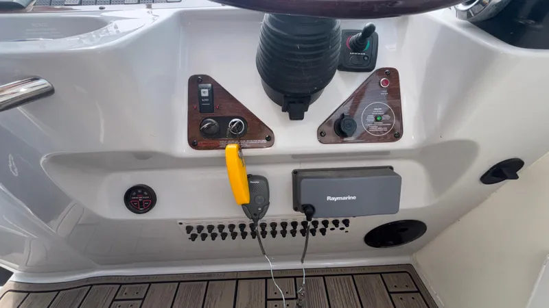 Slide: The Image of Control panel of 2007 Chaparral Signature 330 boat with Raymarine equipment. - 47