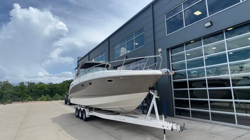 Slide: The Image of 2007 Chaparral Signature 330 boat on trailer outside modern building. - 6